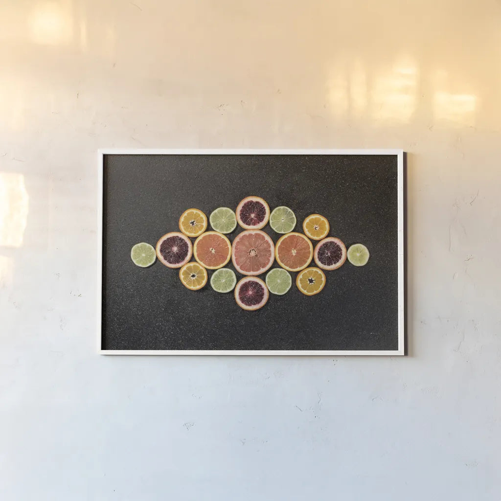 Citrus Drama III by Felicity Bradley. shown as a paper print in a white frame. Available as a archival giclee rolled canvas, fine art paper, or poster print. SKU 45714i.