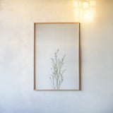 Simple Stems V by Felicity Bradley. shown as a paper print in a natural frame. Available as a archival giclee rolled canvas, fine art paper, or poster print. SKU 48473h.