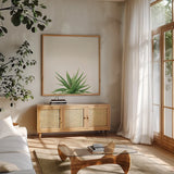Succulent Simplicity I Neutral by Felicity Bradley. Shown in a natural wood frame in a cozy modern living room. Available as an archival giclee rolled canvas, fine art paper, or poster print. SKU 41648a.