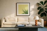 Succulent Simplicity II by Felicity Bradley. Displayed in a glass frame with matte in a clean modern living room. Available as an archival giclee rolled canvas, fine art paper, or poster print. SKU 33835a.