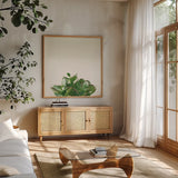 Succulent Simplicity III Neutral by Felicity Bradley. Shown in a natural wood frame in a cozy modern living room. Available as an archival giclee rolled canvas, fine art paper, or poster print. SKU 41650a.