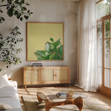 Succulent Simplicity IV by Felicity Bradley. Shown in a natural wood frame in a cozy modern living room. Available as an archival giclee rolled canvas, fine art paper, or poster print. SKU 33837a.