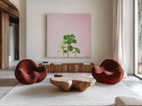 Succulent Simplicity IX on Pink by Felicity Bradley. Shown as extra-large giant wall art in a modern living room. Available as an archival giclee rolled canvas, fine art paper, or poster print. SKU 34352a.