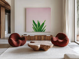 Succulent Simplicity V on Pink by Felicity Bradley. Shown as extra-large giant wall art in a modern living room. Available as an archival giclee rolled canvas, fine art paper, or poster print. SKU 34350a.