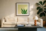 Succulent Simplicity VI by Felicity Bradley. Displayed in a glass frame with matte in a clean modern living room. Available as an archival giclee rolled canvas, fine art paper, or poster print. SKU 33839a.