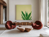 Succulent Simplicity VI by Felicity Bradley. Shown as extra-large giant wall art in a modern living room. Available as an archival giclee rolled canvas, fine art paper, or poster print. SKU 33839a.
