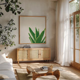 Succulent Simplicity VI Neutral by Felicity Bradley. Shown in a natural wood frame in a cozy modern living room. Available as an archival giclee rolled canvas, fine art paper, or poster print. SKU 41653a.
