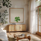 Succulent Simplicity VII Neutral by Felicity Bradley. Shown in a natural wood frame in a cozy modern living room. Available as an archival giclee rolled canvas, fine art paper, or poster print. SKU 41654a.