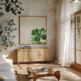 Succulent Simplicity VIII Neutral by Felicity Bradley. Shown in a natural wood frame in a cozy modern living room. Available as an archival giclee rolled canvas, fine art paper, or poster print. SKU 41655a.
