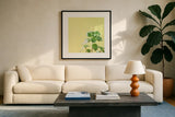 Succulent Simplicity X by Felicity Bradley. Displayed in a glass frame with matte in a clean modern living room. Available as an archival giclee rolled canvas, fine art paper, or poster print. SKU 33843a.