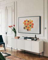 Sunny Citrus III by Felicity Bradley. shown as a framed stretched canvas in a living room above a console. Available as a archival giclee rolled canvas, fine art paper, or poster print. SKU 45710i.