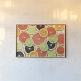 Sunny Citrus IV by Felicity Bradley. shown as a paper print in a natural frame. Available as a archival giclee rolled canvas, fine art paper, or poster print. SKU 45711i.