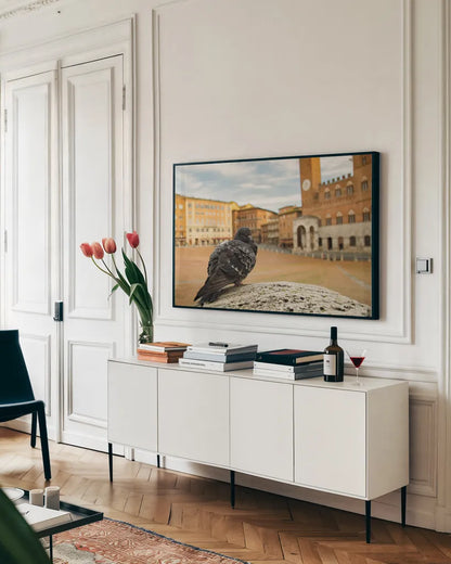 Piazza by Aledanda. shown as a framed stretched canvas in a living room above a console. Available as a archival giclee rolled canvas, fine art paper, or poster print. SKU 98036i.