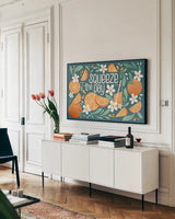 Orange Zest I by Gia Graham. shown as a framed stretched canvas in a living room above a console. Available as a archival giclee rolled canvas, fine art paper, or poster print. SKU 88932i.