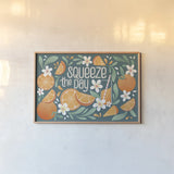 Orange Zest I by Gia Graham. shown as a paper print in a natural frame. Available as a archival giclee rolled canvas, fine art paper, or poster print. SKU 88932i.