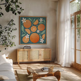 Orange Zest III by Gia Graham. Shown in a natural wood frame in a cozy modern living room. Available as an archival giclee rolled canvas, fine art paper, or poster print. SKU 88934a.
