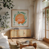 Orange Zest V by Gia Graham. Shown in a natural wood frame in a cozy modern living room. Available as an archival giclee rolled canvas, fine art paper, or poster print. SKU 88936a.