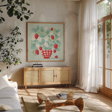 Strawberry Patch by Gia Graham. Shown in a natural wood frame in a cozy modern living room. Available as an archival giclee rolled canvas, fine art paper, or poster print. SKU 87439a.