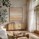 Pink Horizon I by Haley Knighten. Shown in a natural wood frame in a cozy modern living room. Available as an archival giclee rolled canvas, fine art paper, or poster print. SKU 91619a.