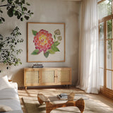 Tropical Fun Flowers II with Gold by Harriet Sussman. Shown in a natural wood frame in a cozy modern living room. Available as an archival giclee rolled canvas, fine art paper, or poster print. SKU 30976a.