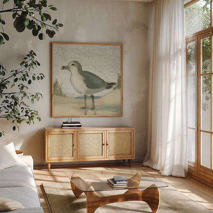 Beach Bird II by James Wiens. Shown in a natural wood frame in a cozy modern living room. Available as an archival giclee rolled canvas, fine art paper, or poster print. SKU 13402a.