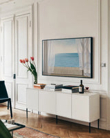 Blue Breeze by James Wiens. shown as a framed stretched canvas in a living room above a console. Available as a archival giclee rolled canvas, fine art paper, or poster print. SKU 12190i.