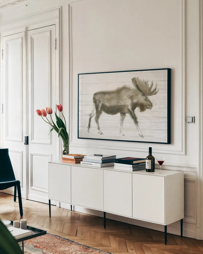 Dark Moose on Wood Crop by James Wiens. shown as a framed stretched canvas in a living room above a console. Available as a archival giclee rolled canvas, fine art paper, or poster print. SKU 38831i.