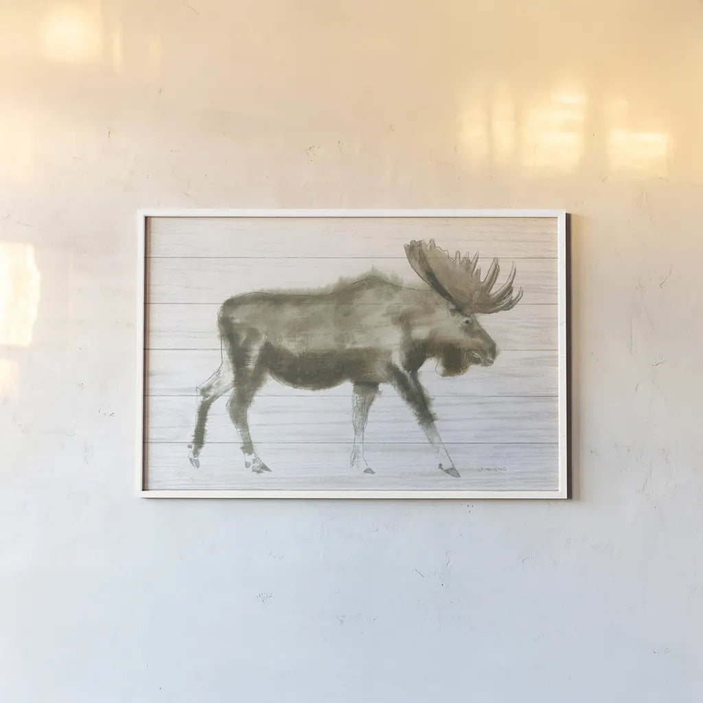 Dark Moose on Wood Crop by James Wiens. shown as a paper print in a white frame. Available as a archival giclee rolled canvas, fine art paper, or poster print. SKU 38831i.