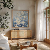 Dogwood Blossoms I Indigo by James Wiens. Shown in a natural wood frame in a cozy modern living room. Available as an archival giclee rolled canvas, fine art paper, or poster print. SKU 23972a.