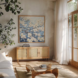 Dogwood Blossoms II Indigo by James Wiens. Shown in a natural wood frame in a cozy modern living room. Available as an archival giclee rolled canvas, fine art paper, or poster print. SKU 23973a.