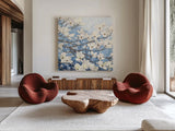 Dogwood Blossoms II Indigo by James Wiens. Shown as extra-large giant wall art in a modern living room. Available as an archival giclee rolled canvas, fine art paper, or poster print. SKU 23973a.