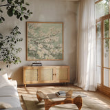Dogwood Blossoms II Sage Green by James Wiens. Shown in a natural wood frame in a cozy modern living room. Available as an archival giclee rolled canvas, fine art paper, or poster print. SKU 11164a.