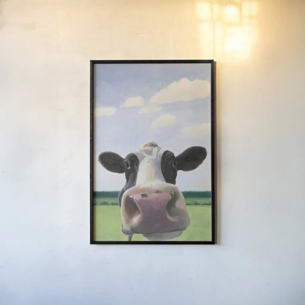 Funny Cow by James Wiens. shown as a paper print in a black flame. Available as a archival giclee rolled canvas, fine art paper, or poster print. SKU 76092h.