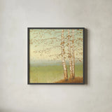 Golden Birch II with Blue Sky by James Wiens. Shown in a sleek black glass frame for a contemporary gallery look. Available as an archival giclee rolled canvas, fine art paper, or poster print. SKU 10342a.