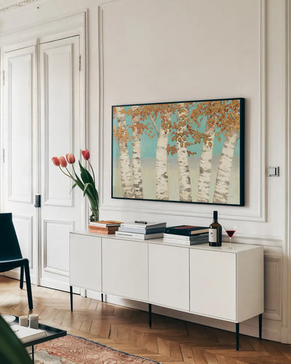 Golden Birches by James Wiens. shown as a framed stretched canvas in a living room above a console. Available as a archival giclee rolled canvas, fine art paper, or poster print. SKU 12234i.