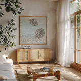 Gracefully Blue II by James Wiens. Shown in a natural wood frame in a cozy modern living room. Available as an archival giclee rolled canvas, fine art paper, or poster print. SKU 38342a.