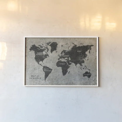 Grunge World Map by James Wiens. shown as a paper print in a white frame. Available as a archival giclee rolled canvas, fine art paper, or poster print. SKU 54955i.