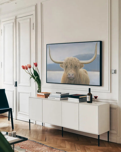 Highland Cow by James Wiens. shown as a framed stretched canvas in a living room above a console. Available as a archival giclee rolled canvas, fine art paper, or poster print. SKU 50229i.
