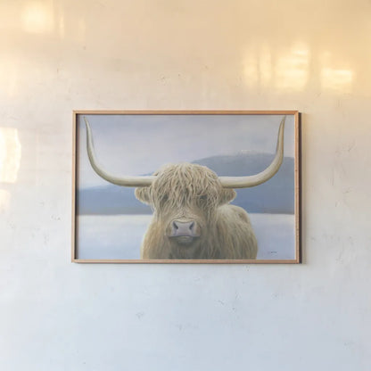 Highland Cow by James Wiens. shown as a paper print in a natural frame. Available as a archival giclee rolled canvas, fine art paper, or poster print. SKU 50229i.