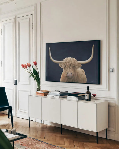 Highland Cow Navy by James Wiens. shown as a framed stretched canvas in a living room above a console. Available as a archival giclee rolled canvas, fine art paper, or poster print. SKU 56160i.