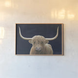 Highland Cow Navy by James Wiens. shown as a paper print in a natural frame. Available as a archival giclee rolled canvas, fine art paper, or poster print. SKU 56160i.