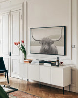 Highland Cow Neutral by James Wiens. shown as a framed stretched canvas in a living room above a console. Available as a archival giclee rolled canvas, fine art paper, or poster print. SKU 51630i.