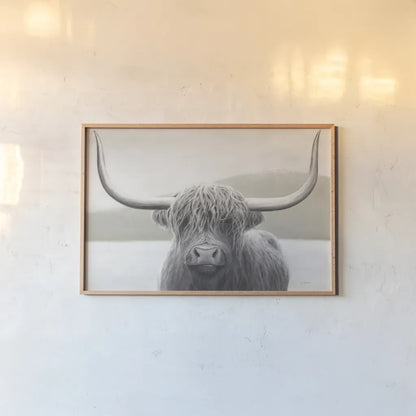 Highland Cow Neutral by James Wiens. shown as a paper print in a natural frame. Available as a archival giclee rolled canvas, fine art paper, or poster print. SKU 51630i.