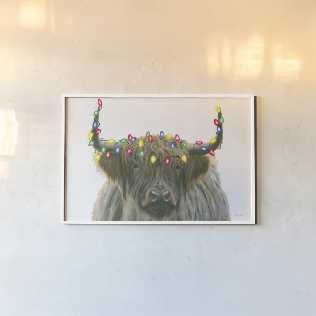 Holiday Highlander by James Wiens. shown as a paper print in a white frame. Available as a archival giclee rolled canvas, fine art paper, or poster print. SKU 56448i.
