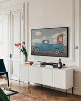 Lets Go for a Ride II Vintage Blue Truck by James Wiens. shown as a framed stretched canvas in a living room above a console. Available as a archival giclee rolled canvas, fine art paper, or poster print. SKU 84143i.