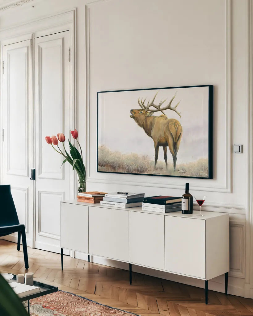 Majestic Elk Brown by James Wiens. shown as a framed stretched canvas in a living room above a console. Available as a archival giclee rolled canvas, fine art paper, or poster print. SKU 30571i.