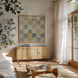 Neutrality Abstract Gold by James Wiens. Shown in a natural wood frame in a cozy modern living room. Available as an archival giclee rolled canvas, fine art paper, or poster print. SKU 23490a.