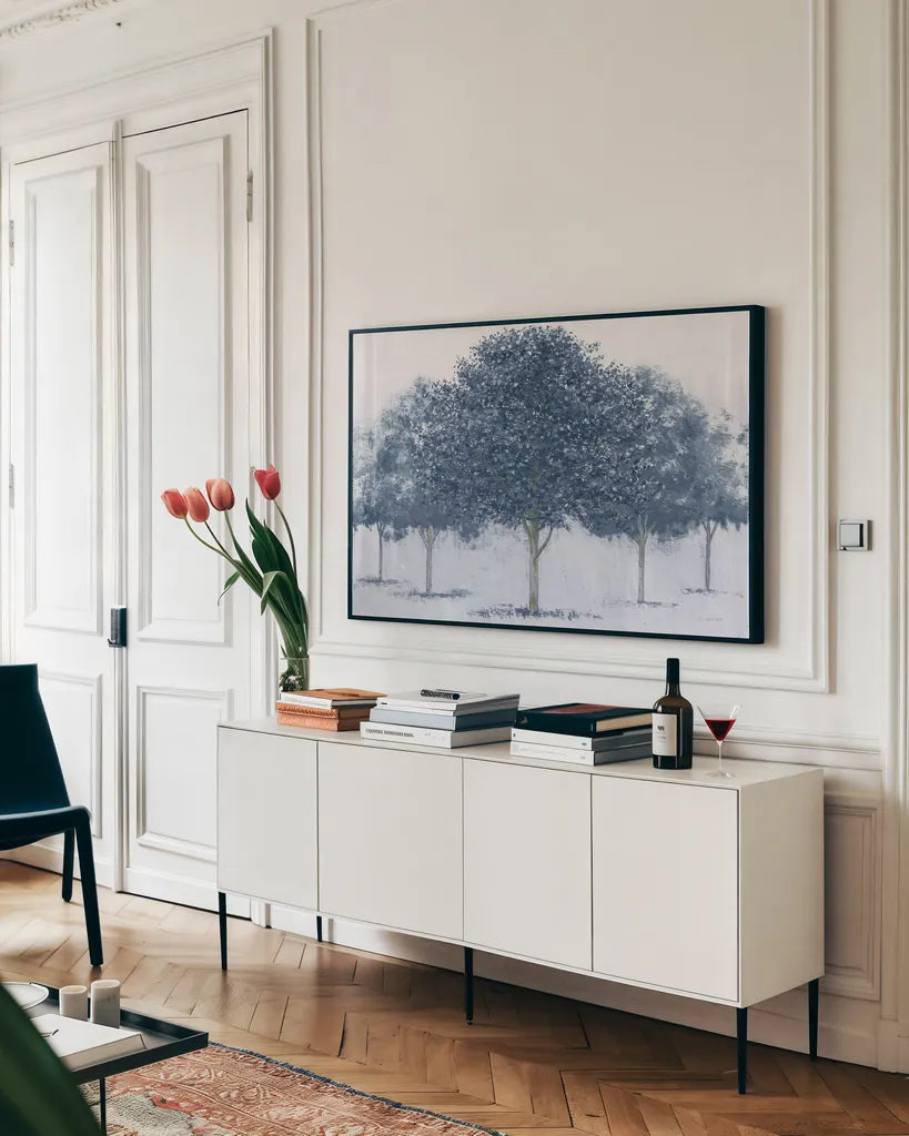 Peaceful Grove Navy by James Wiens. shown as a framed stretched canvas in a living room above a console. Available as a archival giclee rolled canvas, fine art paper, or poster print. SKU 91612i.