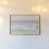 Serene Seaside with Boat by James Wiens. shown as a paper print in a natural frame. Available as a archival giclee rolled canvas, fine art paper, or poster print. SKU 33505i.