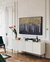 Shimmering Forest Indigo by James Wiens. shown as a framed stretched canvas in a living room above a console. Available as a archival giclee rolled canvas, fine art paper, or poster print. SKU 55721i.